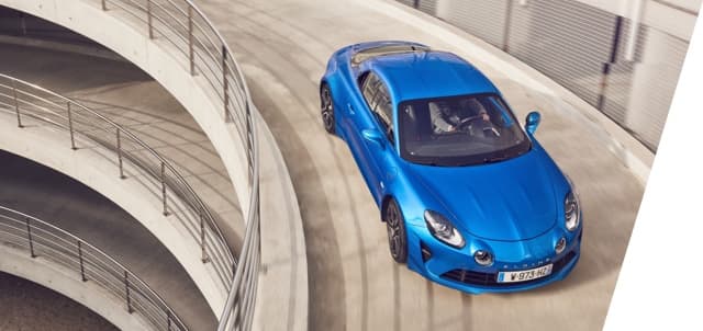 Alpine A110 in a car par