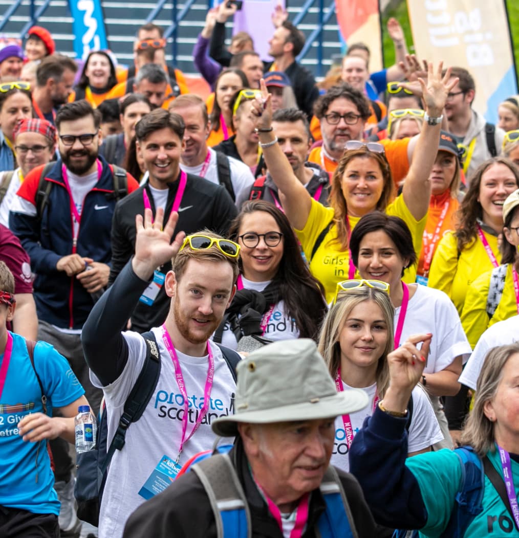 Crowd of people waving at the Kiltwalk