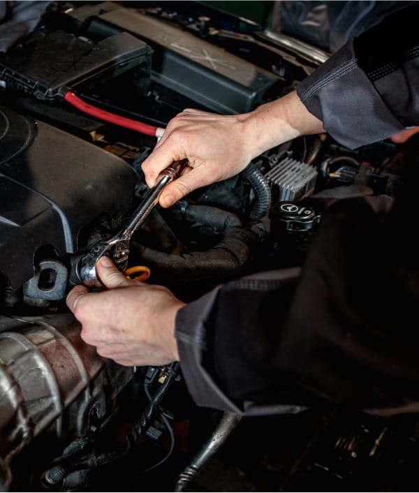 Arnold Clark mechanic using wrench