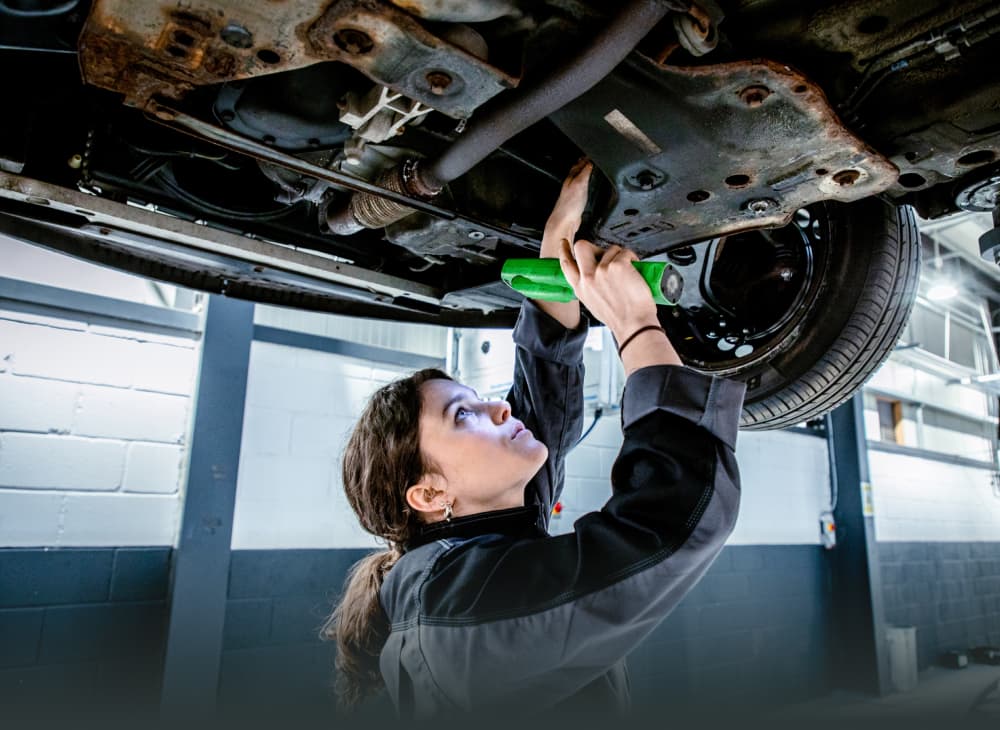 Mechanic under a car